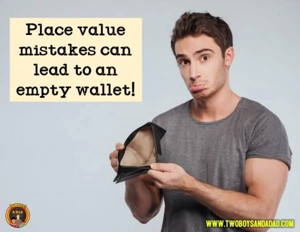 Man holding an empty wallet because he made a place value mistake